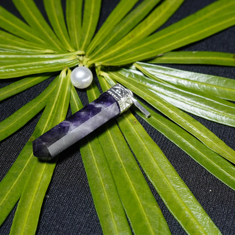 Hand-selected amethyst pendant on natural backdrop